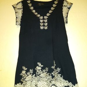 Black top with beige embroidery